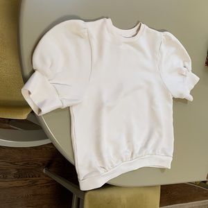 Super soft sweatshirt with feminine short sleeves . Never worn .